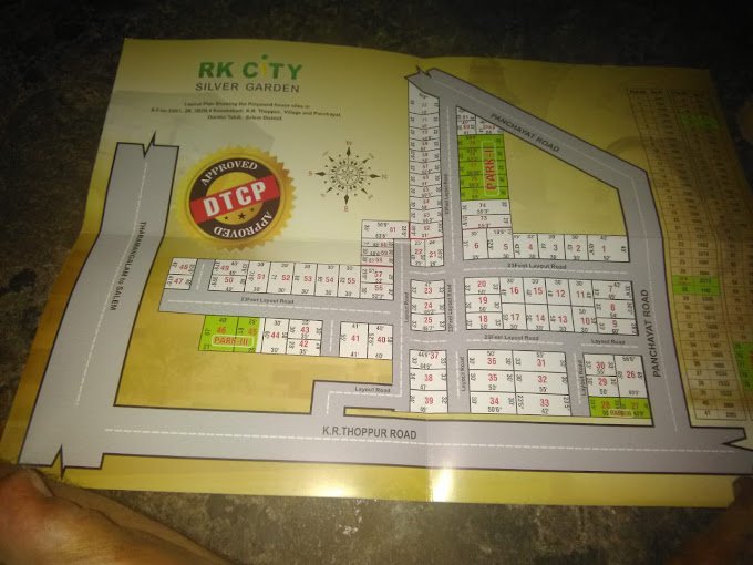 Map layout of RK City Silver Garden showing plots, roads, and parking areas, approved by DTCP.